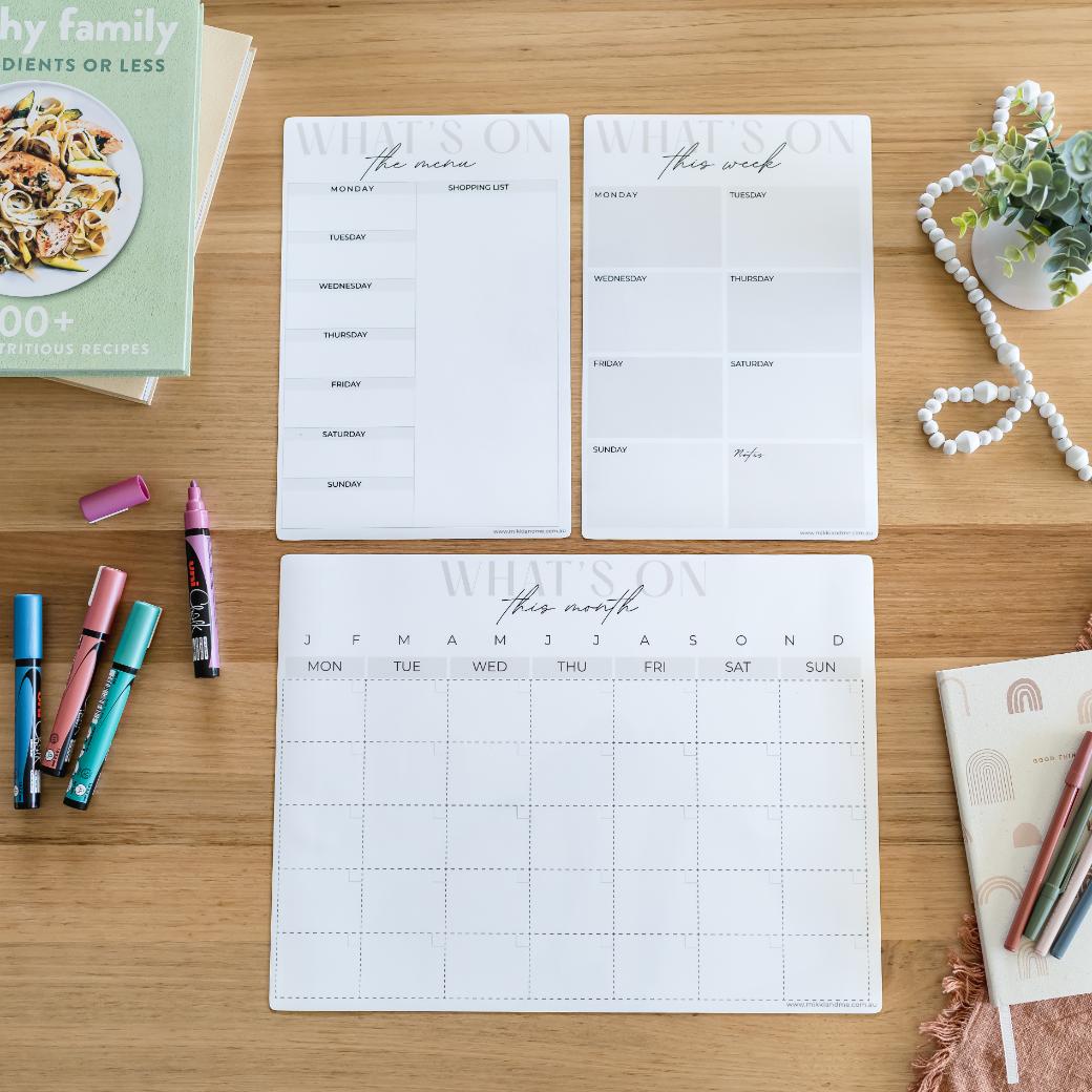 fridge showing a bundle of magnetic planners for meal planning, monthly planning and a shopping list