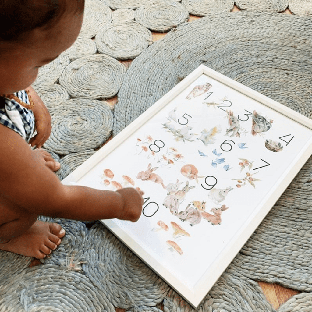 Hand-illustrated nursery and playroom wall art prints depicting animals and numbers